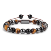 Luce esta elegante pulsera con piedras naturales de Ojo de Tigre, Obsidiana Negra y Hematite. Protección, coraje y equilibrio en un solo accesorio.