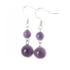Aretes de plata con amatista en cuentas pulidas que reflejan calma y profundidad natural.