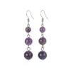 Aretes de plata con amatista en cuentas pulidas que reflejan calma y profundidad natural.